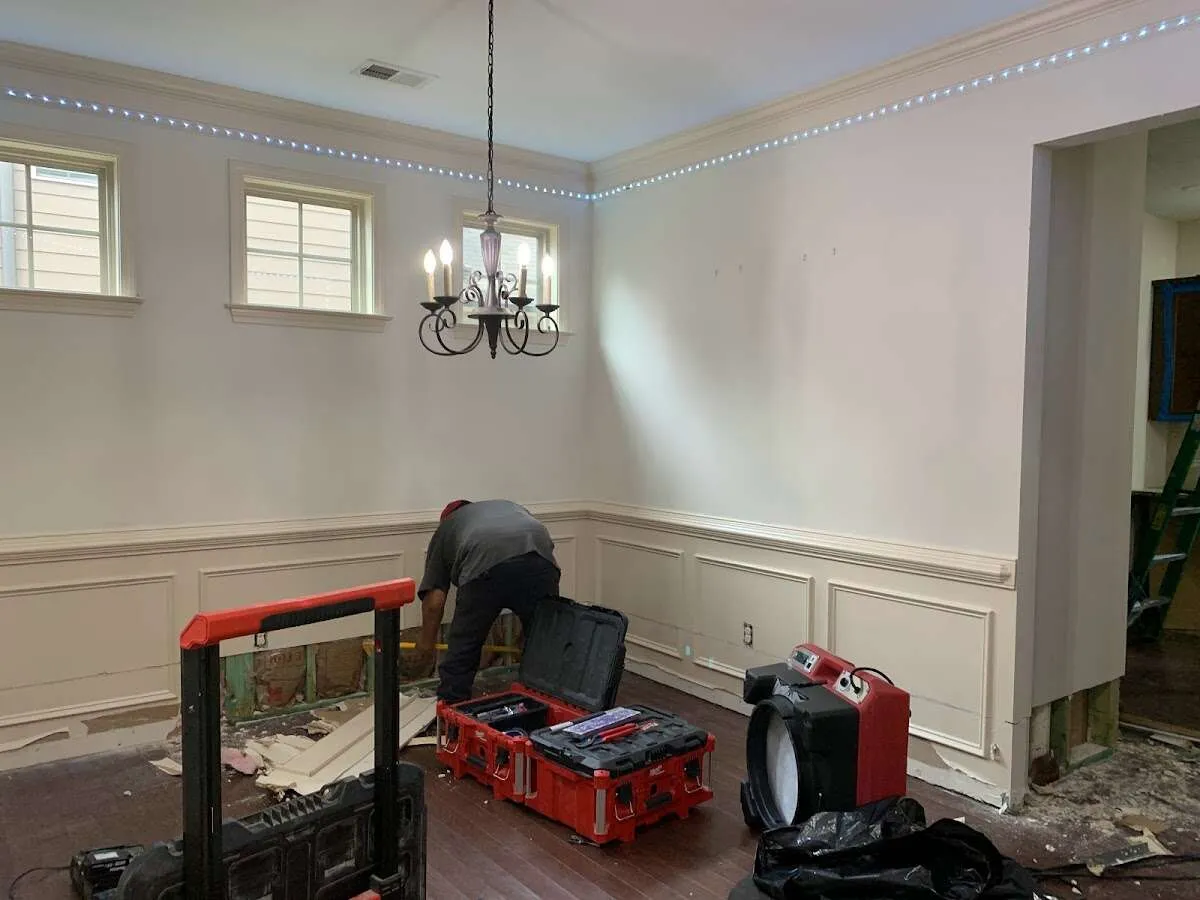 Restoration technician with professional equipment in Port Chester